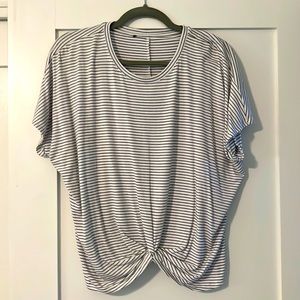 Black and white striped, beautiful drape and short sleeve. Ruching center front.